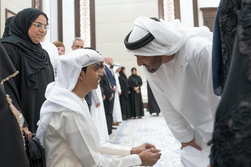 ABU DHABI, UNITED ARAB EMIRATES - May 21, 2019: HH Sheikh Mohamed bin Zayed Al Nahyan, Crown Prince of Abu Dhabi and Deputy Supreme Commander of the UAE Armed Forces (R), receives members of Adheedak group during an iftar reception at Al Bateen Palace.

( Eissa Al Hammadi for the Ministry of Presidential Affairs )
---