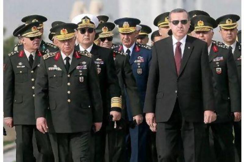 Gen Isik Kosaner, front left, next to the Turkish prime minister Recep Tayyip Erdogan, front right, at a ceremony in 2010.