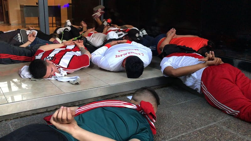 Video grab showing detained supporters of River Plate. AFP