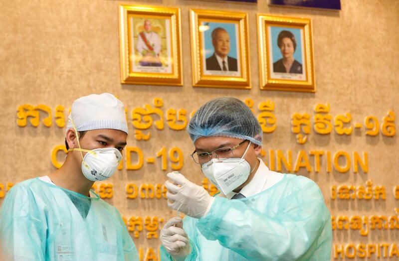 A health worker prepares to inject a vaccine shot at Calmette Hospital in Phnom Penh, Cambodia. EPA