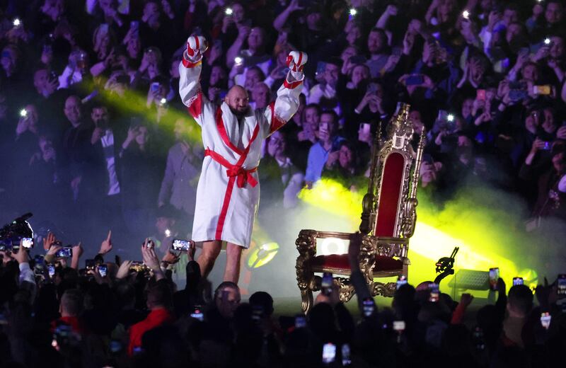 Tyson Fury pumps his arms to the crowd during his ring walk to fight Dillian Whyte. Getty