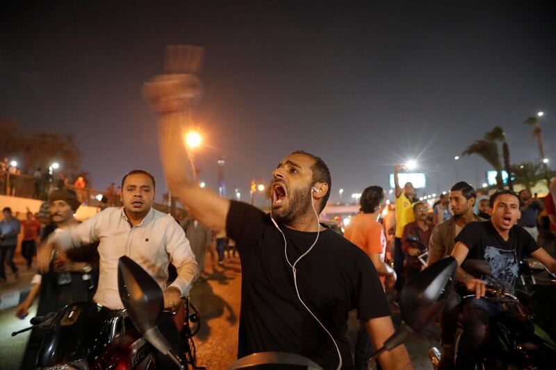 Small groups of protesters gather in central Cairo shouting anti-government slogans. Reuters