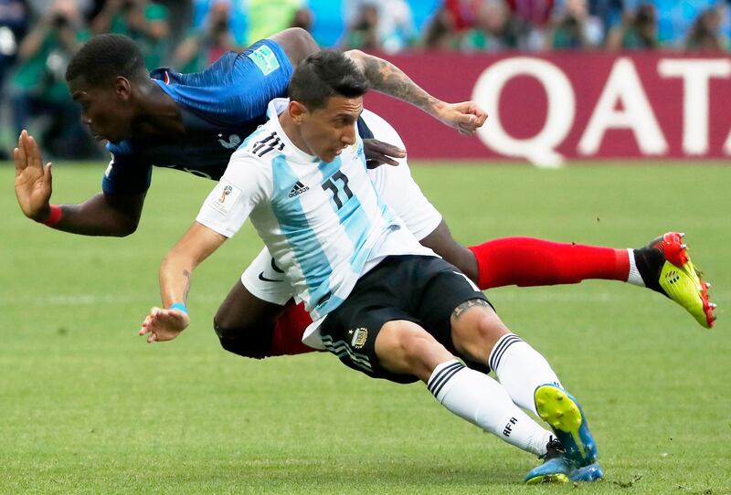 Angel Di Maria, right, of Argentina and Paul Pogba of France in action. Diego Azubel / EPA