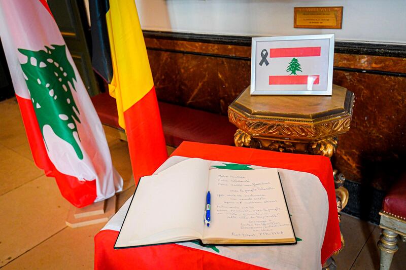 A book of condolence for victims of Beirut blast, is displayed at Brussels city hall. AFP
