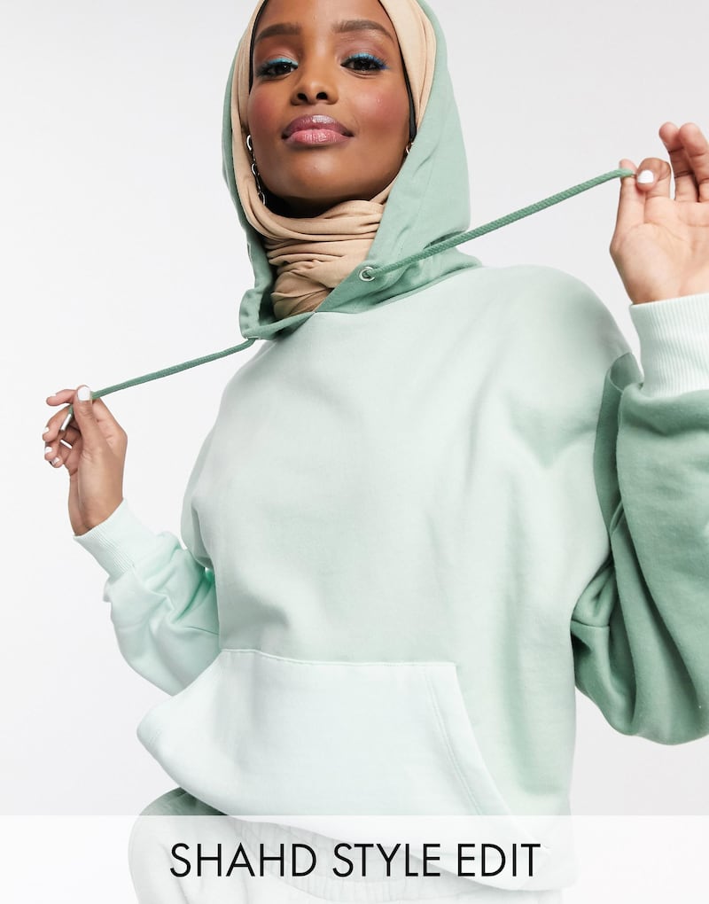 In a soft hoodie, a model wears the Asos edit by Shahd Batal.