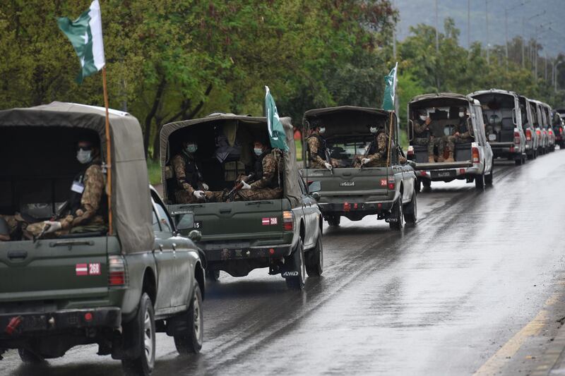 Pakistan Army troops patrol after a government announced lockdown of the city for concerns over the spread of the coronavirus, in Islamabad, Pakistan, Tuesday, March 24, 2020. Pakistani authorities meanwhile said they'd shut down train operations across the country from Wednesday until March 31 in an effort to contain the spread of the virus. (AP Photo/B.K. Bangash)