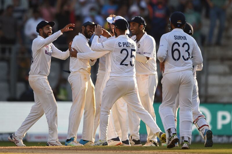 India celebrate the dismissal of New Zealand's Tom Blundell after he was run out for a duck. AFP