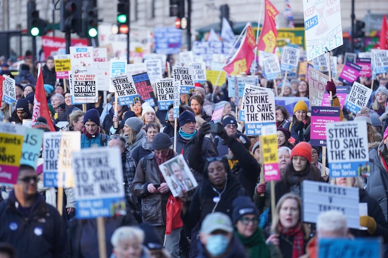 Protesters march through Trafalgar Square, towards Downing Street, London, during a nurses' strike. PA