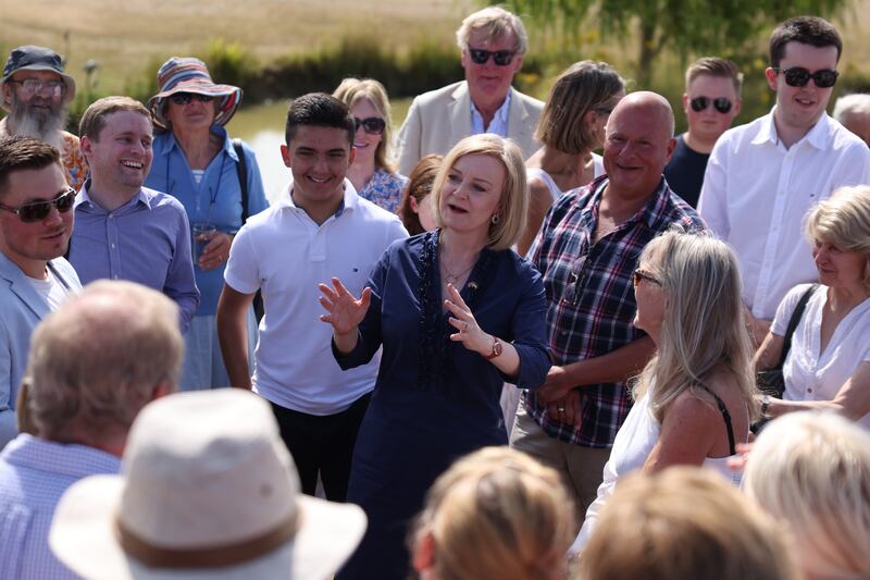 Ms Truss speaks to people while campaigning in Marden. Getty