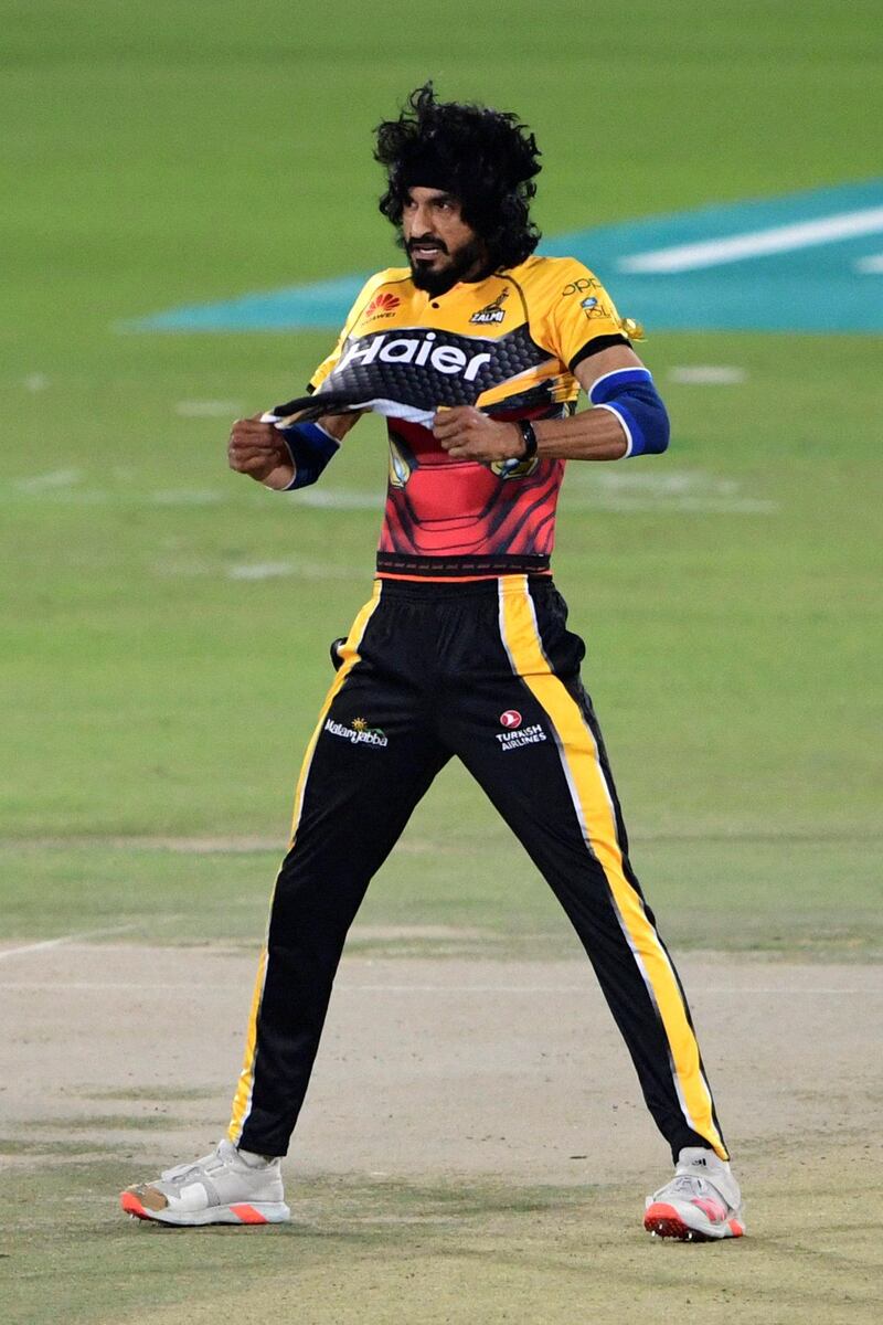Peshawar Zalmi's Umaid Asif celebrates after taking the wicket of Islamabad United's Faheem Ashraf (not pictured) during the Pakistan Super League (PSL) T20 cricket match between Islamabad United and Peshawar Zalmi at the National Stadium in Karachi on February 27, 2021. (Photo by Asif HASSAN / AFP)