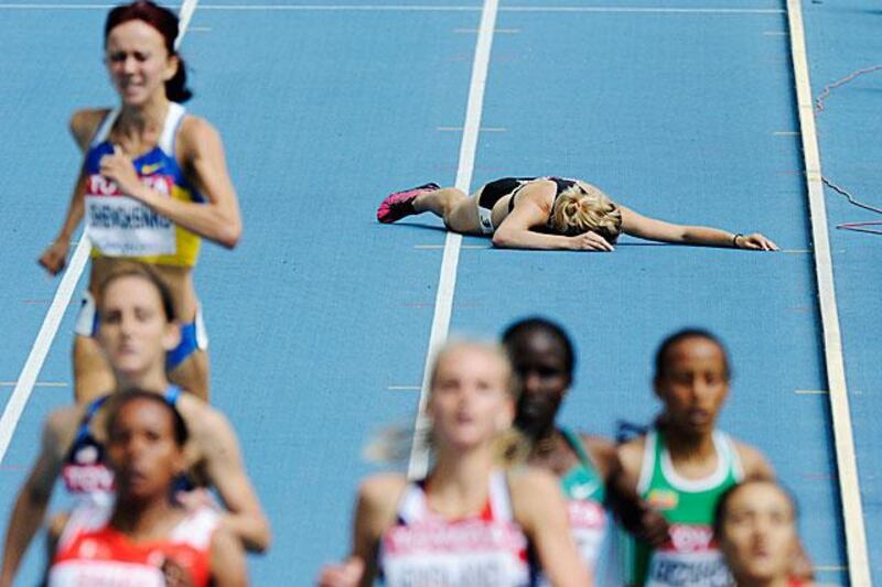 New Zealandâ€™s Nikki Hamblin falls in the women's 1500m heat as the pack moves on. 

Martin Meissner / AP Photo