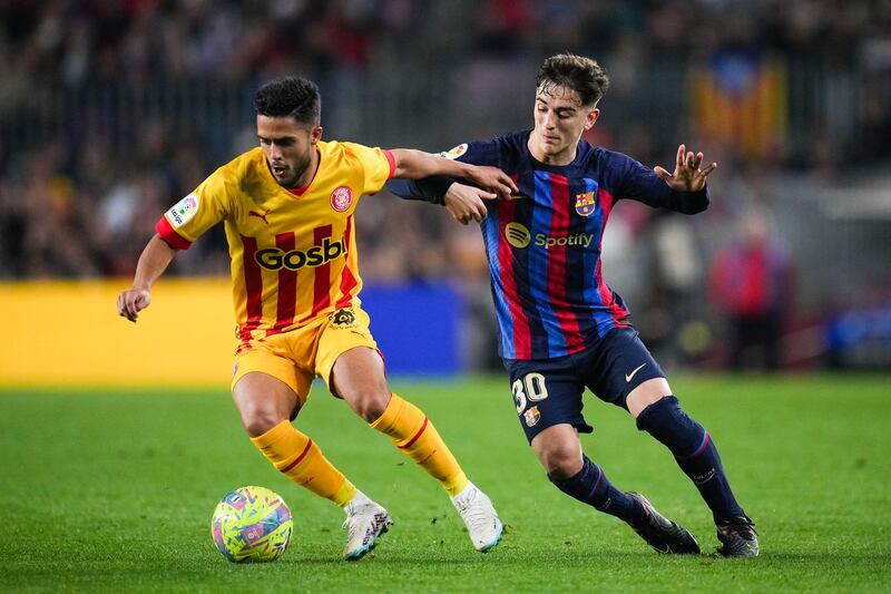 Yan Couto of Girona fights for the ball with Gavi of Barcelona during their LaLiga clash at Camp Nou on April 10, 2023. Getty