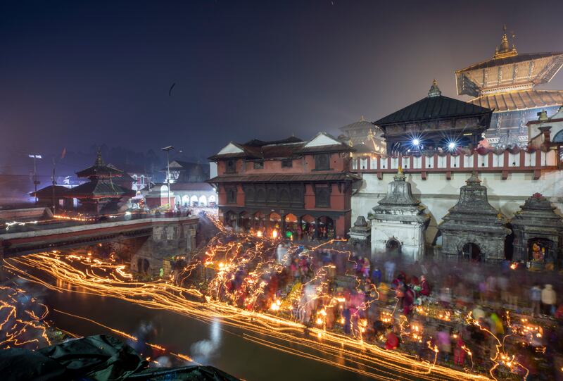 Nepalese devotees release oil lamps in memory of dead family members as they observe the Balachaturdashi festival in Kathmandu. EPA