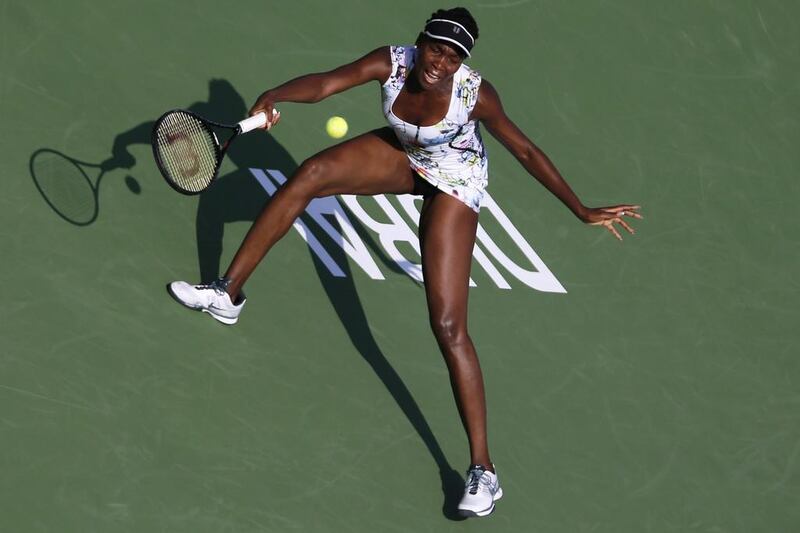 Venus Williams of the USA hits a return to Flavia Pennetta of Italy during their women’s singles match at the Dubai Tennis Championships on February 20, 2014. Ahmed Jadallah / Reuters