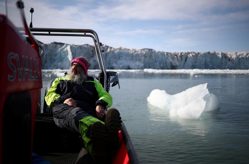 International director of the Norwegian Polar Institute, Kim Holmen, relaxes with a cup of tea as he travels past a glacia on Svalbard, the Norwegian archipelago that has been his home for three decades. Reuters, file