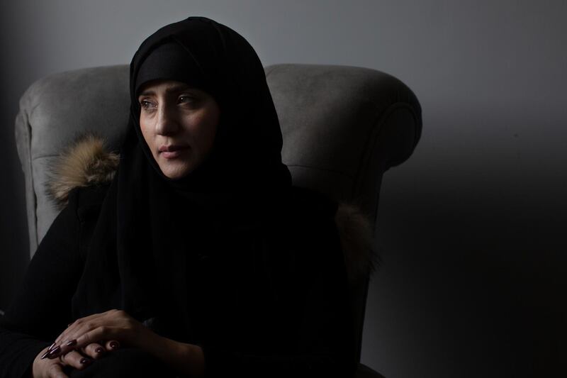 In this Wednesday, March 4, 2020 photo, Samera al-Huri, 33, poses for a portrait in her home near Cairo, Egypt. "Many had it worse than me," said al-Huri, who survived three months in detention by Houthi rebels who rule northern Yemen in Yemen. As they grow more politically active, women are increasingly targeted by the Houthi rebels. Hundreds of women have vanished into secret prisons where they are tortured and sometimes raped, former detainees and other activists say. The Houthis deny the claims, but six women who escaped to Egypt spoke to the Associated Press about their ordeals. (AP Photo/Maya Alleruzzo)
