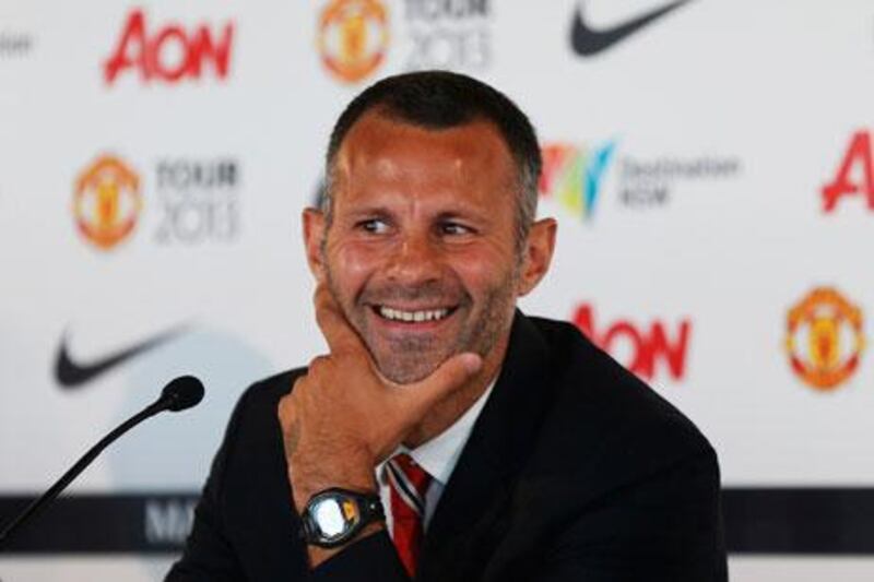 Ryan Giggs can look on the funny side during a news conference on Sunday in Sydney. Daniel Munoz / Reuters