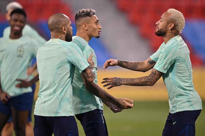 Dani Alves, Raphinha and Neymar. AFP