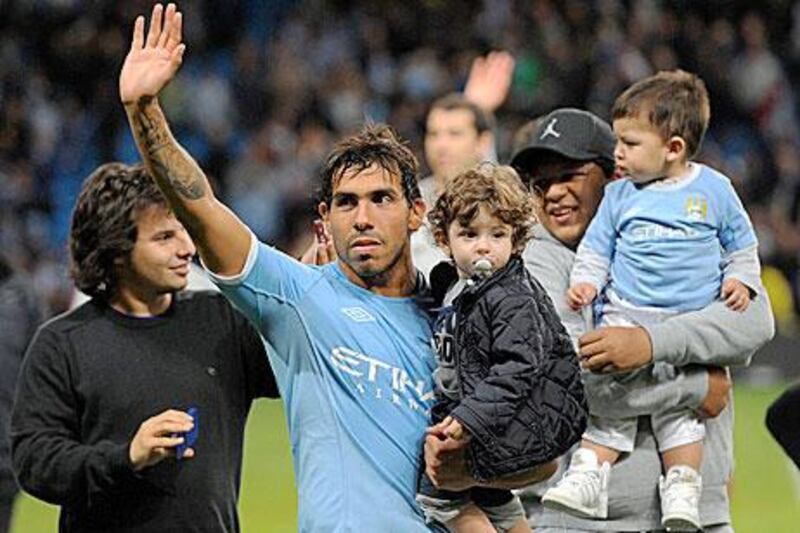 Tevez, during a lap of honour last night at Manchester, has said he wants more time with his daughters.