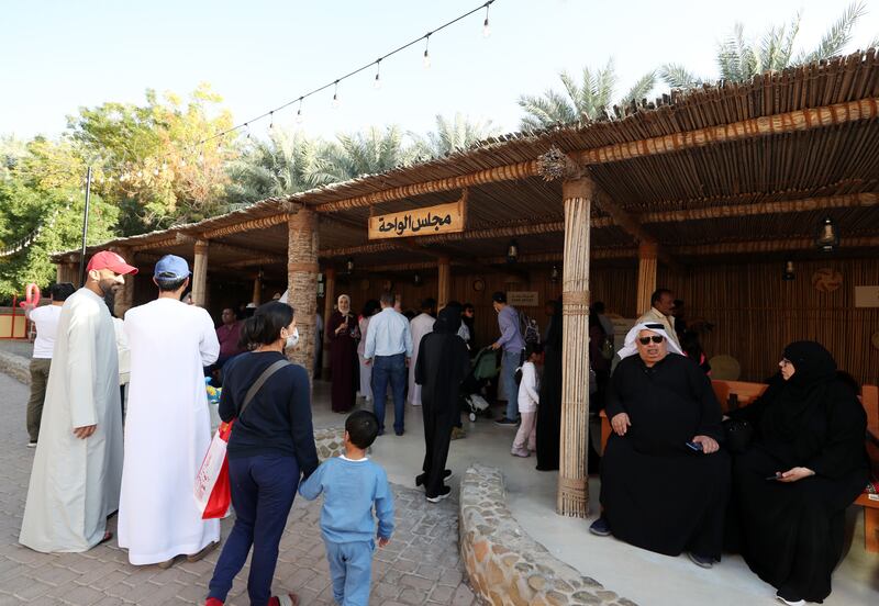 People visit the Saturday Market at Al Ain Oasis