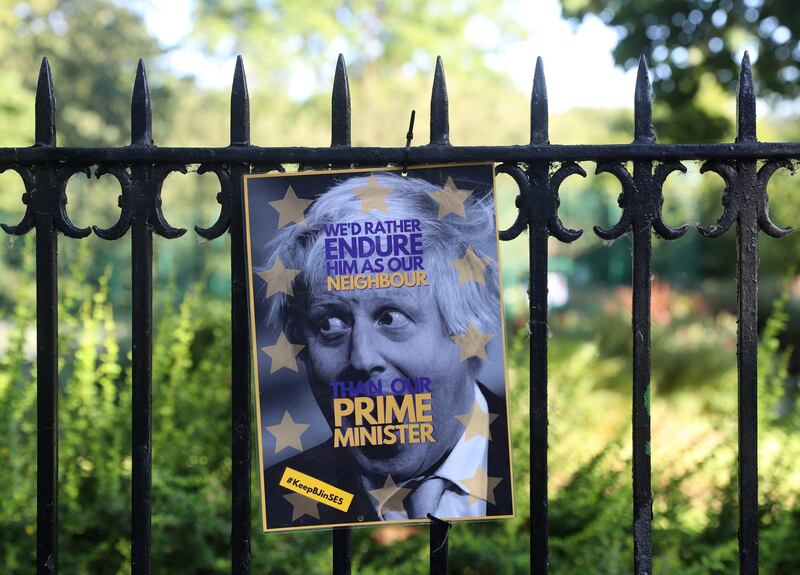 A poster depicting PM hopeful Boris Johnson hangs on a fence of the park opposite to his house in London, Britain June 22, 2019. REUTERS/Simon Dawson