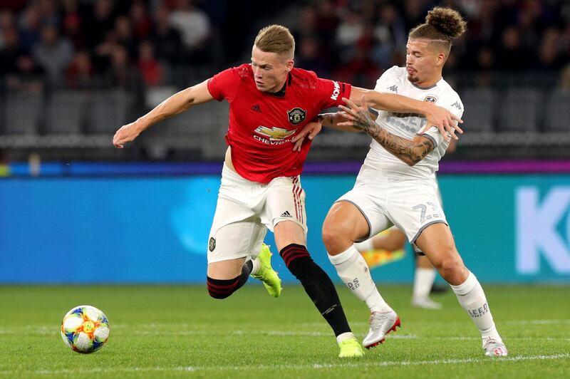 Scott McTominay holds off Leeds United's Kemar Roofe. EPA