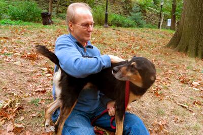 William Hurt plays with his dog, Lucy, in Riverside Park in New York. Photo: AP