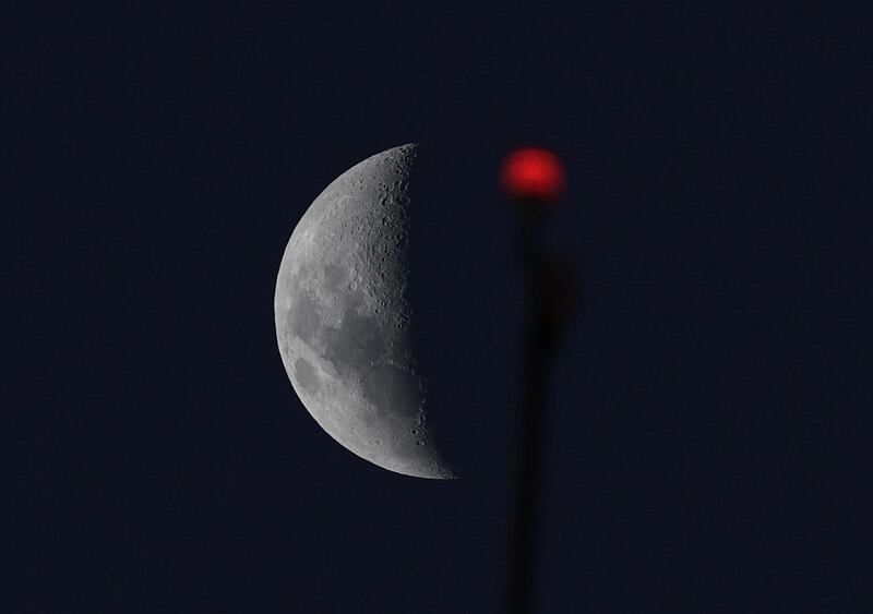 The moon is seen from the Monumental stadium in Buenos Aires during the Copa Libertadores Group A football match between Argentina's River Plate and Peru's Alianza Lima. River Plate won 3-0. AFP