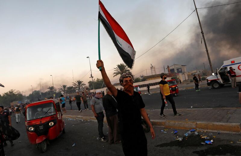 People hold an anti-government protest in Baghdad, Iraq October 5, 2019. Picture taken October 5, 2019. REUTERS/Thaier Al-Sudani