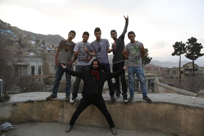 'District Unknown', from left, Qasem, Qais, Pedram, Yousef and Lemar with director Travis Beard, front, rocking out in Kabul. Courtesy Travis Beard