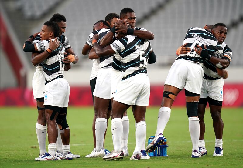 Fiji players celebrate victory.