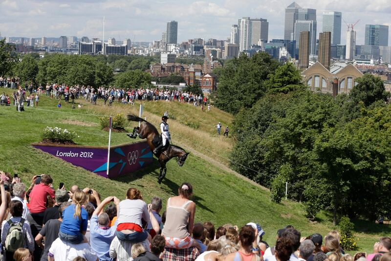 Alena Tseliapushkina of Belarus rides Passat as she competes in the equestrian eventing cross-country stage at the 2012 Summer Olympics, Monday, July 30, 2012, in London. (AP Photo/Ng Han Guan)