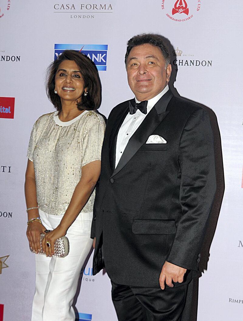 Indian Bollywood actors Rishi Kapoor(R)poses with his wife Neetu Singh pose as they attend the ‘Hello! Hall of Fame Awards 2016’ in Mumbai late April 11, 2016. (Photo by STR / AFP)