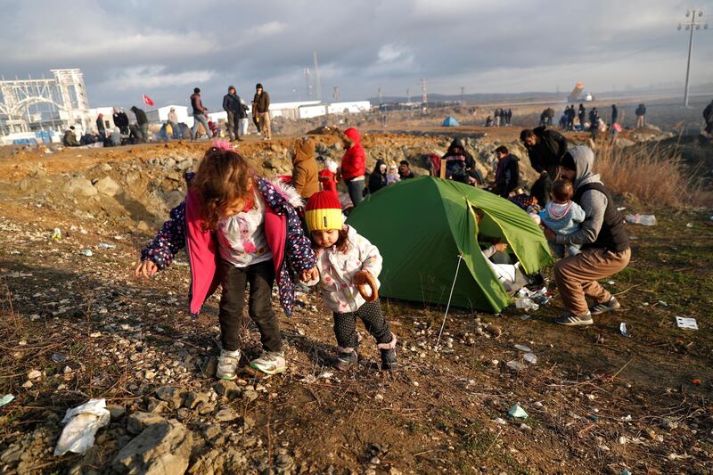 Migrant children from Syria are seen on a road side near Turkey's Ipsala border crossing with Greece's Kipi, in Edirne, Turkey. REUTERS
