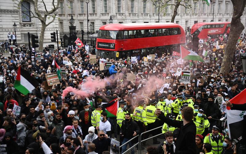 Supporters of Palestine attend a demonstration outside Downing Street, in London. EPA