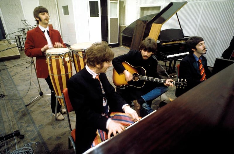 Ringo Starr, John Lennon, George Harrison and Paul McCartney working on Sgt Pepper’s Lonely Hearts Club Band at Abbey Road Studios in London, 1967. Courtesy Apple Corps Ltd