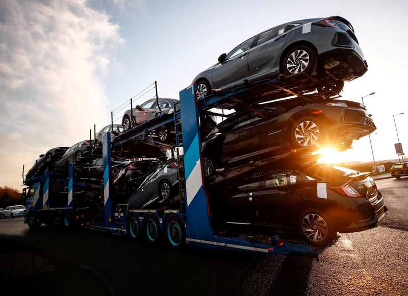 FILE PHOTO: A lorry with car carrier trailer leaves the Honda car plant in Swindon, Britain, February 18, 2019. REUTERS/Eddie Keogh/File Photo