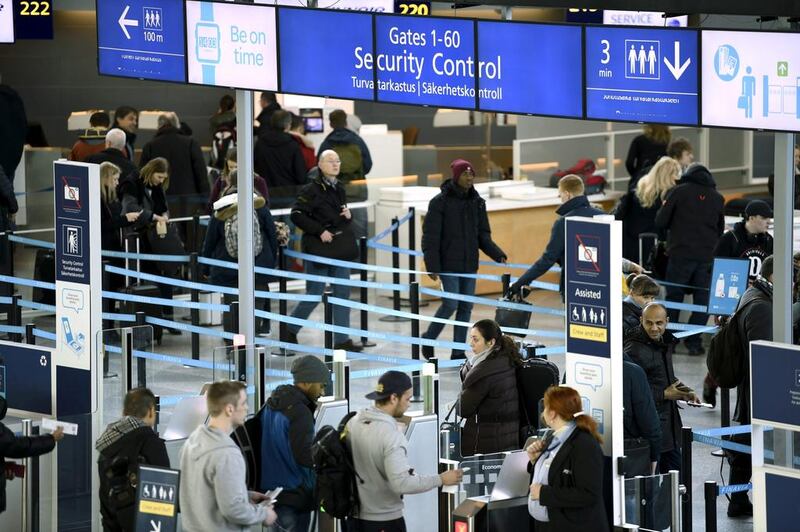 Passengers enter the security control area at Helsinki airport in Finland. Airports and airlines divide passengers along lines of wealth and passports – and few seem to mind these divisions. Lehtikuva/Antti Aimo-Koivisto/via Reuters