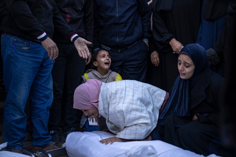 Palestinians mourn their relatives killed in the Israeli bombardment of the Gaza Strip, at a hospital in Khan Younis. AP