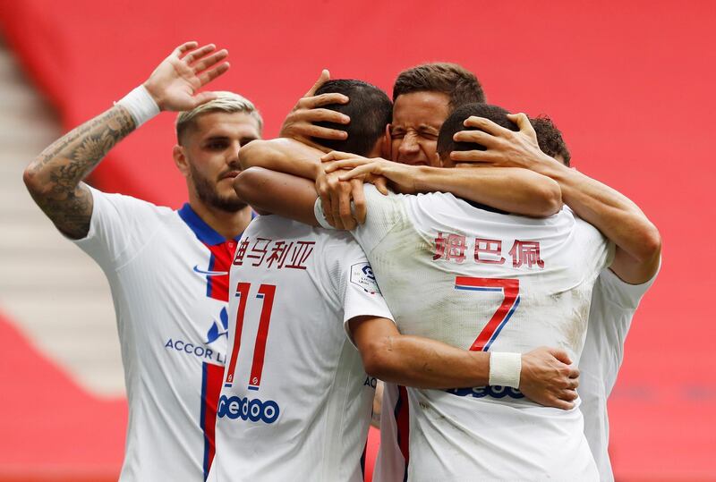 Angel Di Maria celebrates scoring their second goal with teammates. Reuters