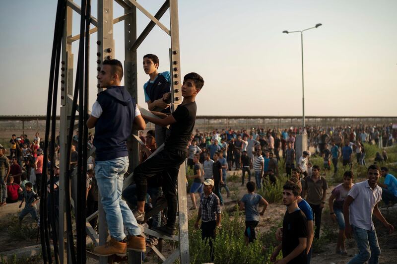 Palestinian gather during a protest at the entrance of Erez border crossing. AP