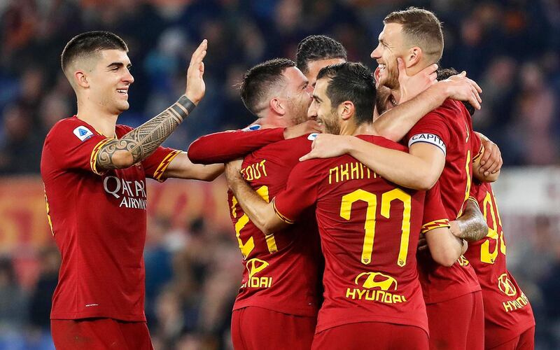 epa08370792 (FILE) - Roma's Edin Dzeko (R) celebrates with teammates after scoring the 3-0 lead during the Italian Serie A soccer match between AS Roma and US Lecce at the Olimpico stadium in Rome, Italy, 23 February 2020 (reissued on 18 April 2020). According to Italian media reports AS Roma players agreed on cut their salaries up to four months (March, April, May and June) if the Italian Serie A Season won't re-start because of the COVID-19 coronavirus pandemic. If the current season will re-start, some of these wages will be spread on the budget of the 2020-2021 season.  EPA/RICCARDO ANTIMIANI *** Local Caption *** 55899398