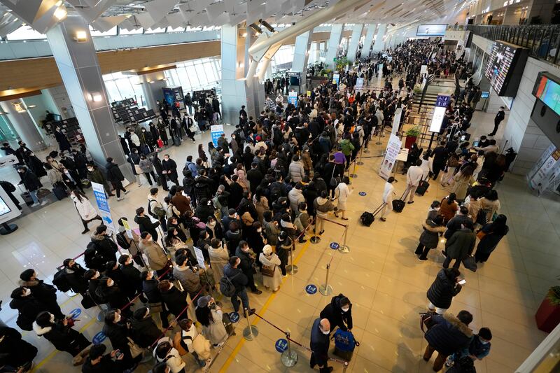 Passengers line up to board planes at Gimpo airport in Seoul, South Korea, ahead of the Lunar New Year holiday. AP Photo