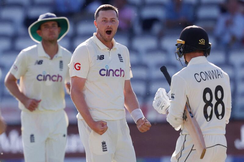 England's Ollie Robinson celebrates taking the wicket of New Zealand's Devon Conway  on the fourth day of the first Test at Lord's.