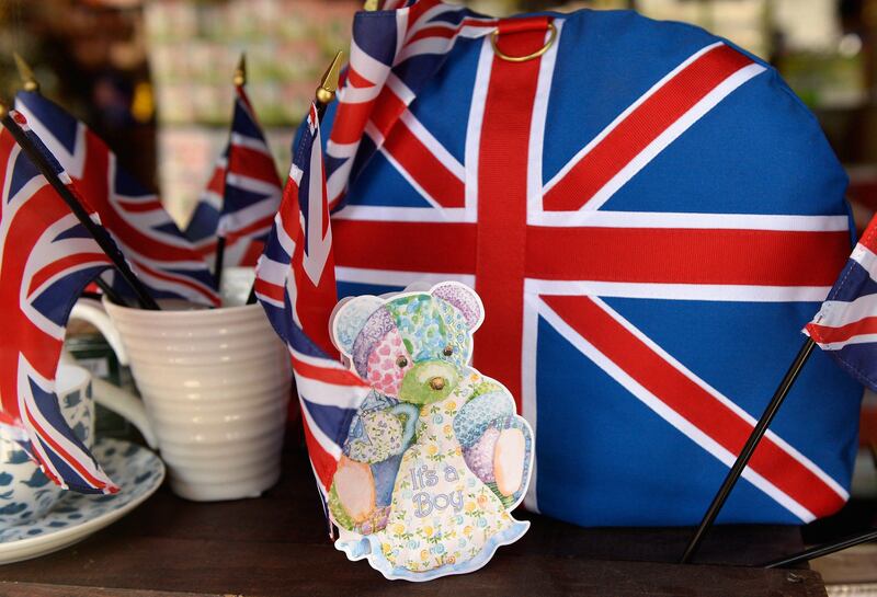 SANTA MONICA, CA - JULY 22: British and baby decorations are seen after the announcement of the birth of Catherine, Duchess of Cambridge, and her husband Prince William's first child, at Ye Olde King's Head English pub's gift shop July 22, 2013 in Santa Monica, California. The Royal couple had a baby boy who was born at 16.24 BST and weighed 8 pounds, 6 ounces. The child, who is now third in line to the throne, has yet to be named.   Kevork Djansezian/Getty Images/AFP== FOR NEWSPAPERS, INTERNET, TELCOS & TELEVISION USE ONLY ==
 *** Local Caption ***  597398-01-09.jpg