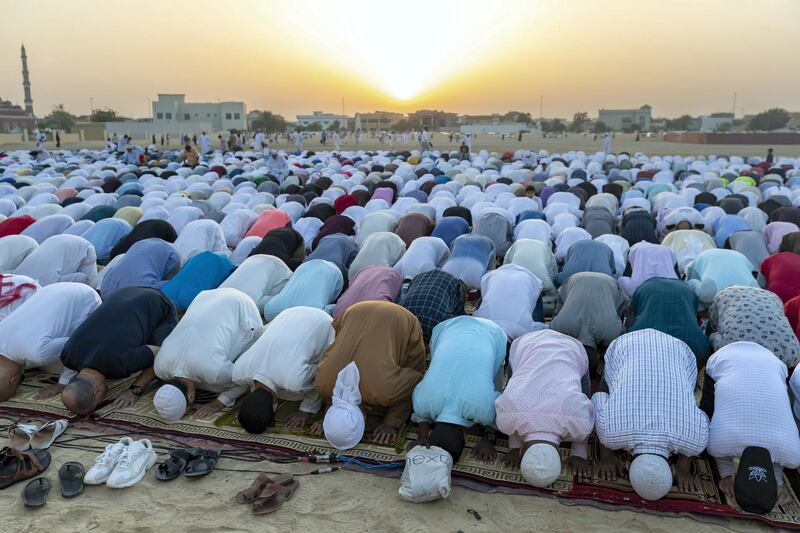 Dubai, United Arab Emirates - June 04, 2019: The first Eid prayer is performed at the Eid prayer ground. Tuesday the 4th of June 2019. Al Barsha, Dubai. Chris Whiteoak / The National