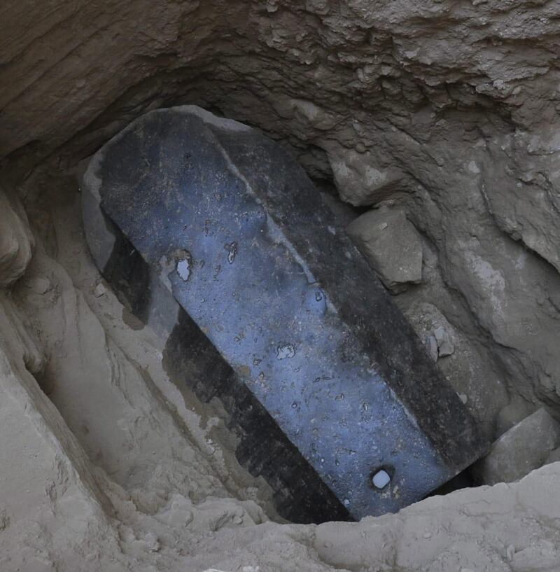 An undated handout photo made available by the Egyptian ministry of Antiquities shows the black granite sarcophagus at the discovered tomb in the Sidi Gaber district of Alexandria. EPA