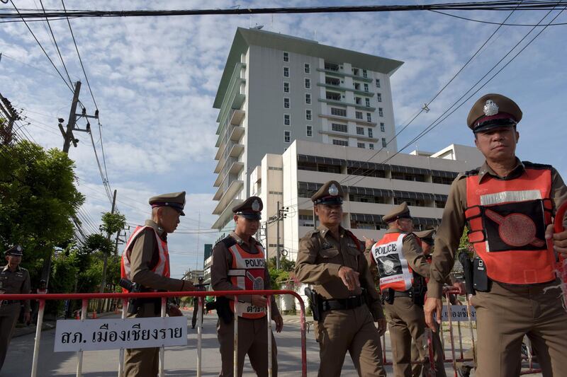 Thai policemen block a road leading to the hospital where the boys rescued after being trapped in a nearby cave for nearly two weeks have being brought for observation, in the northern Thai city of Chiang Rai. AFP