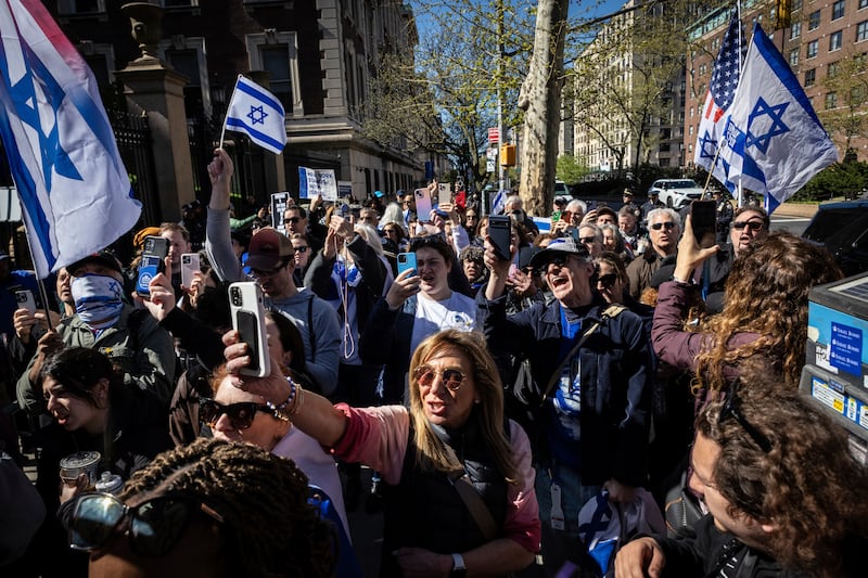 Pro-Israeli demonstrators chant 'shame' after Columbia University assistant professor Shai Davidai was denied access to the main campus. AP