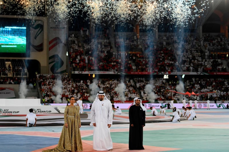 From left: Balqees Fathi, Hussain Al Jassmi and Eida Al Menhali perform during the opening ceremony. AFP